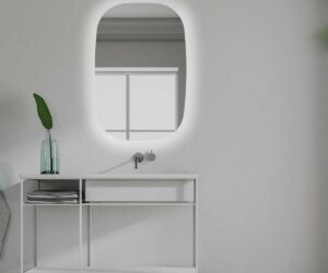 White bathroom sink standing in a Scandinavian style bathroom interior with a narrow vertical horizontal mirror hanging above it. 3d rendering mock up